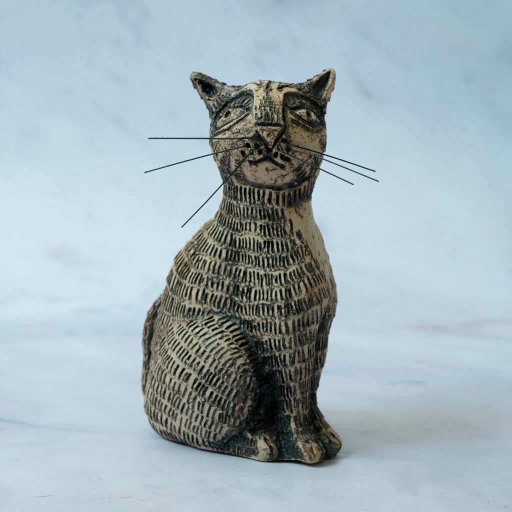 SEATED CAT WITH WHISKERS